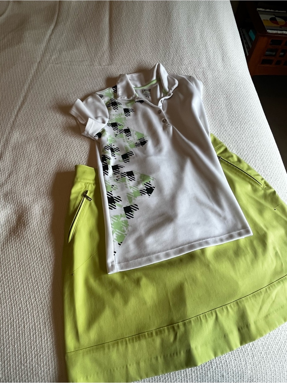 Izod golf set in lime and white, golf shirt and skort.